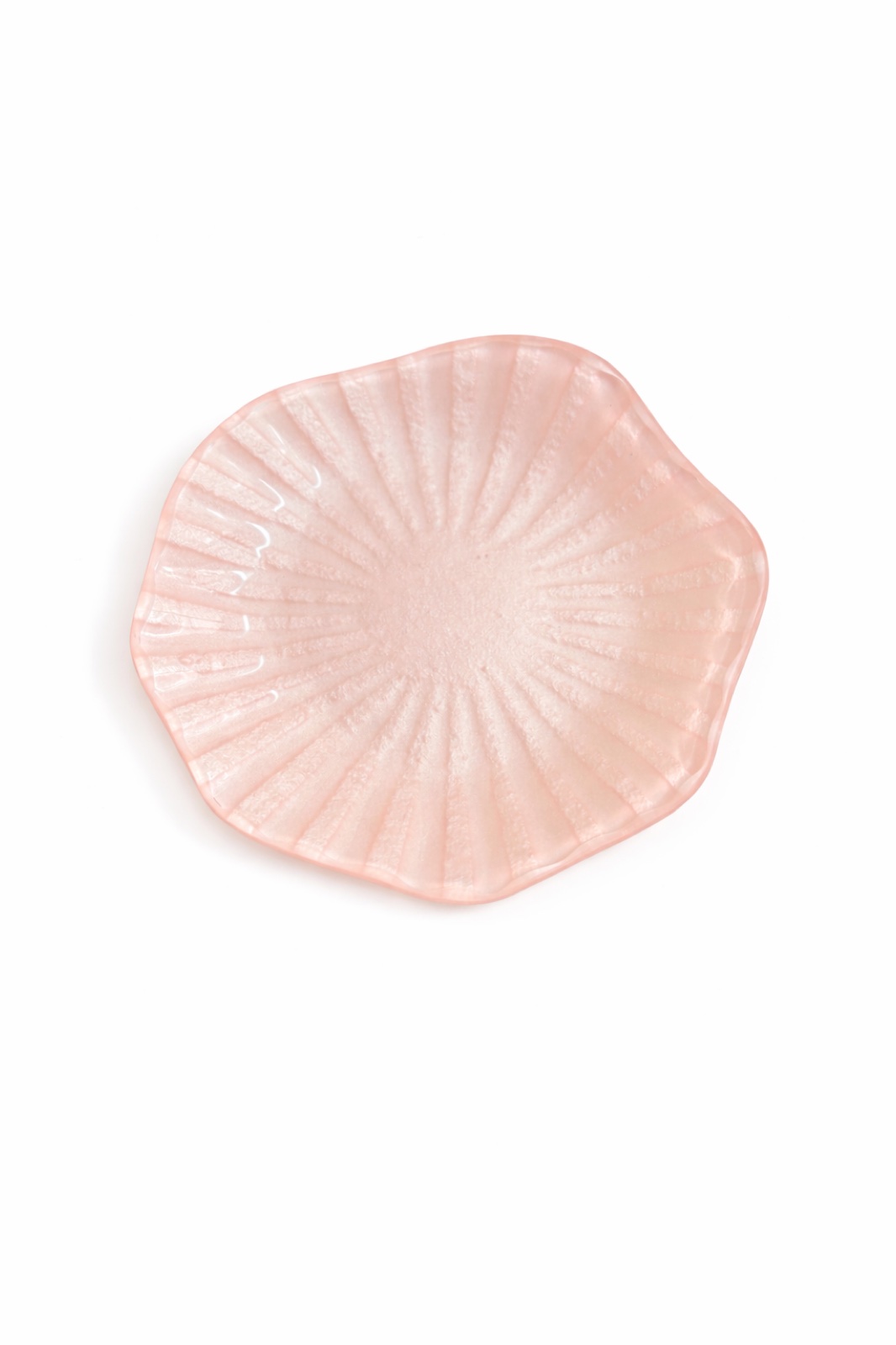 Blush-pink fluted glass trinket bowl on a clean white backdrop